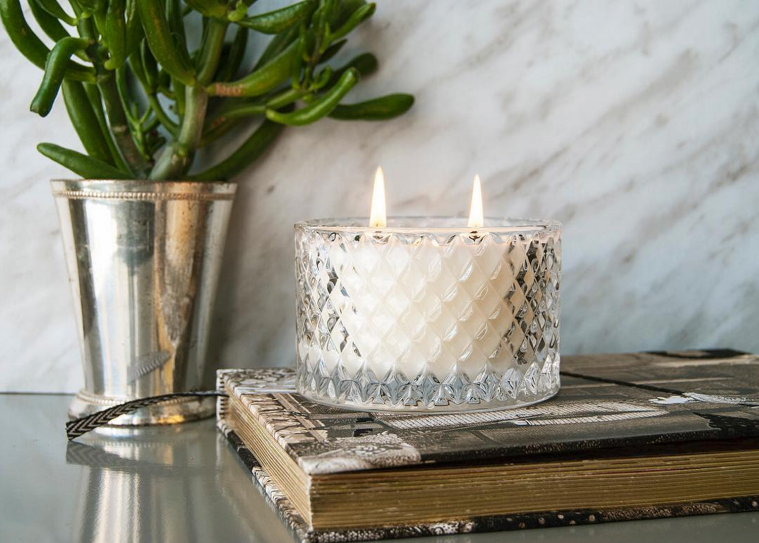 The multi-facetted starlet clear glass candle